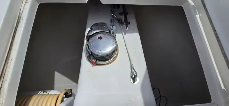 Slide: The Image of Anchor compartment of 2018 Cobia 301 Center Console with winch. - 15