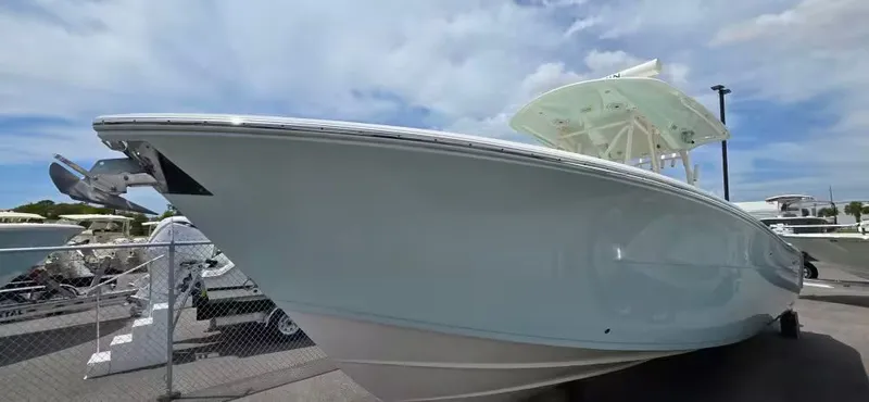 Slide: The Image of 2018 Cobia 301 Center Console boat at the dock. - 3
