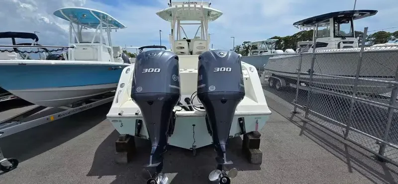 Slide: The Image of 2018 Cobia 301 Center Console with twin outboard engines. - 5