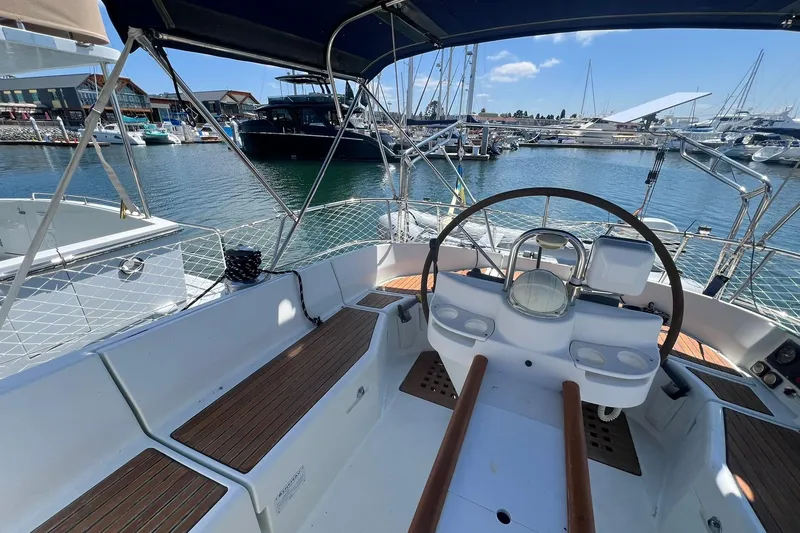 Slide: The Image of Cockpit view of 2001 Beneteau Oceanis 461 sailboat docked in marina. - 10