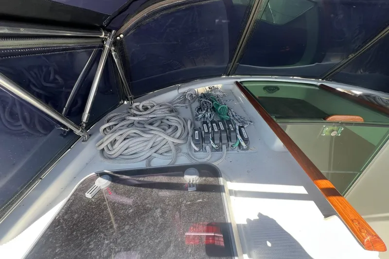 Slide: The Image of 2001 Beneteau Oceanis 461 sailboat cockpit with ropes and control panels. - 11