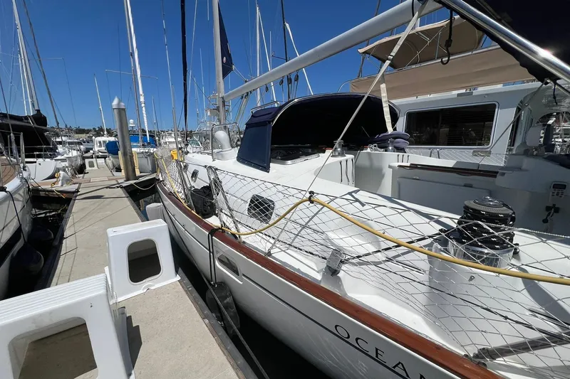 Slide: The Image of 2001 Beneteau Oceanis 461 sailboat docked at marina under clear blue sky. - 17