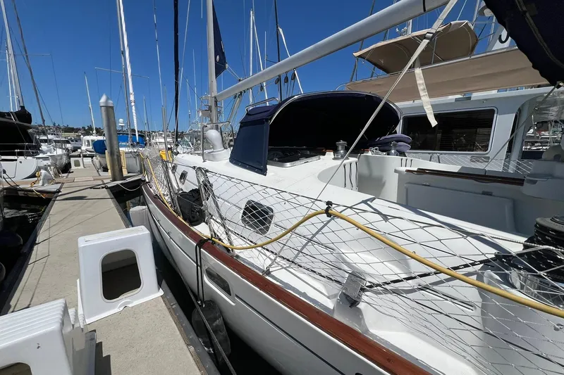 Slide: The Image of 2001 Beneteau Oceanis 461 sailboat docked at marina under clear blue sky. - 18