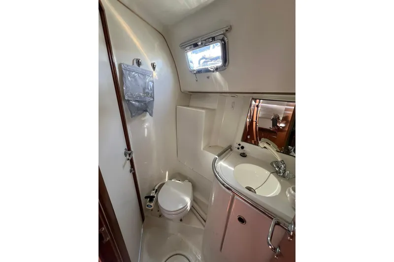 Slide: The Image of Bathroom interior of 2001 Beneteau Oceanis 461 yacht, featuring sink and toilet. - 34