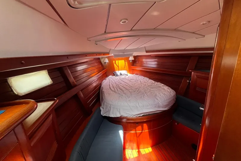 Slide: The Image of Cozy cabin interior of 2001 Beneteau Oceanis 461 sailboat with wooden finish and comfortable bed. - 38