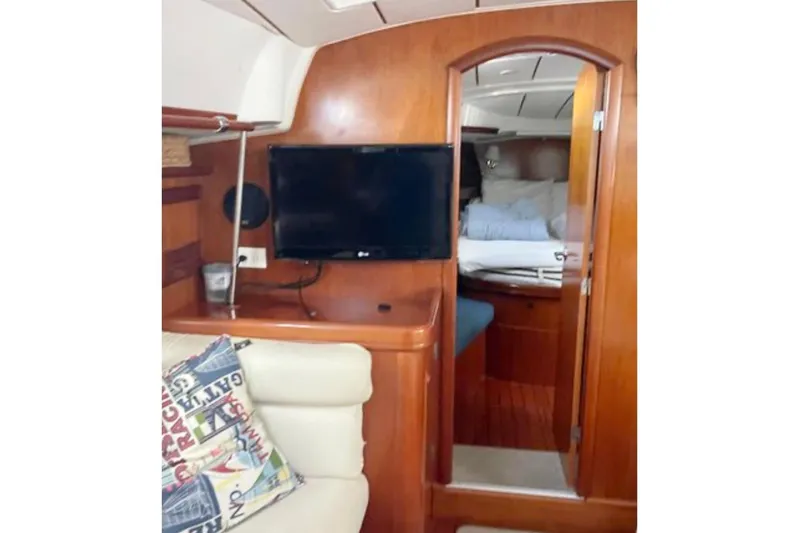 Slide: The Image of Interior of 2001 Beneteau Oceanis 461 yacht with cozy cabin and mounted TV. - 4