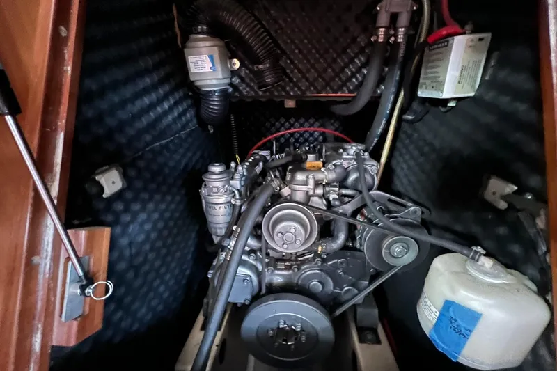 Slide: The Image of Engine compartment of a 2001 Beneteau Oceanis 461 sailboat, showcasing mechanical components. - 43