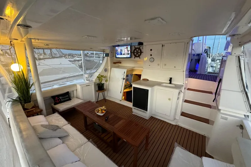 Slide: The Image of Luxurious interior of a 2000 Silverton 453 Motor Yacht with cozy seating and decor. - 12
