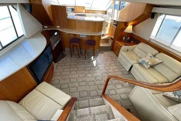 Slide: The Image of Luxurious interior of 2000 Silverton 453 Motor Yacht with elegant seating and modern amenities. - 13