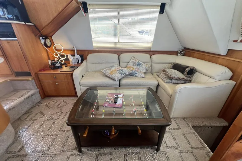 Slide: The Image of Luxurious interior of a 2000 Silverton 453 Motor Yacht with plush seating and elegant decor. - 14