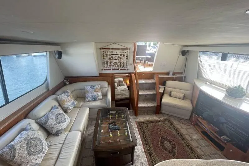 Slide: The Image of Luxurious interior of 2000 Silverton 453 Motor Yacht with elegant seating and decor. - 15