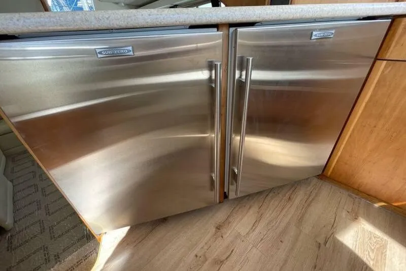 Slide: The Image of Stainless steel refrigerator doors in a 2000 Silverton 453 Motor Yacht kitchen. - 23