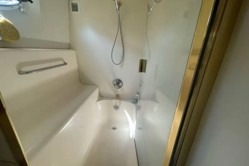 Slide: The Image of Shower area in a 2000 Silverton 453 Motor Yacht, featuring sleek design and modern fixtures. - 30