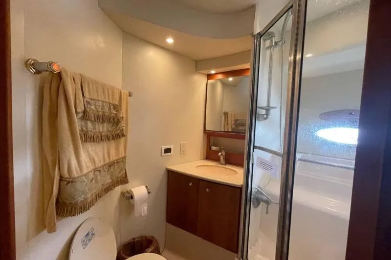 Slide: The Image of Bathroom interior of 2000 Silverton 453 Motor Yacht with shower and vanity. - 36