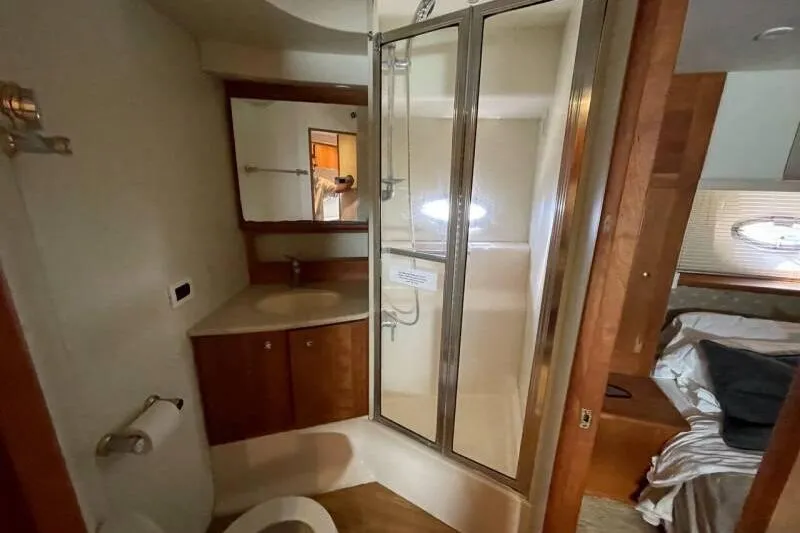 Slide: The Image of Bathroom interior of 2000 Silverton 453 Motor Yacht with shower and vanity. - 37