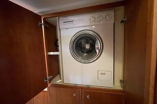 Slide: The Image of Washing machine inside a 2000 Silverton 453 Motor Yacht wooden cabinet. - 39