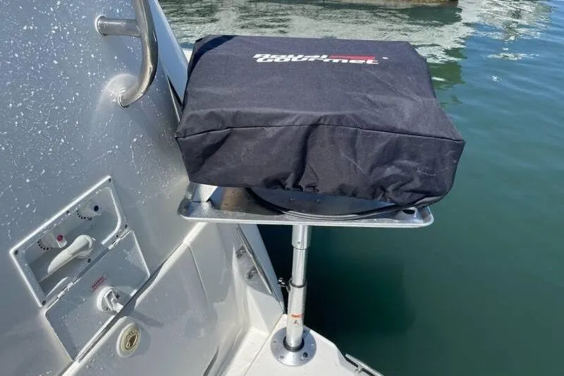 Slide: The Image of Covered grill on a 2000 Silverton 453 Motor Yacht, near water. - 43