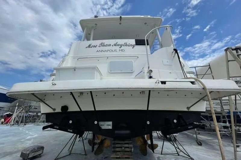 Slide: The Image of 2000 Silverton 453 Motor Yacht in dry dock, Annapolis, MD, under a blue sky. - 44