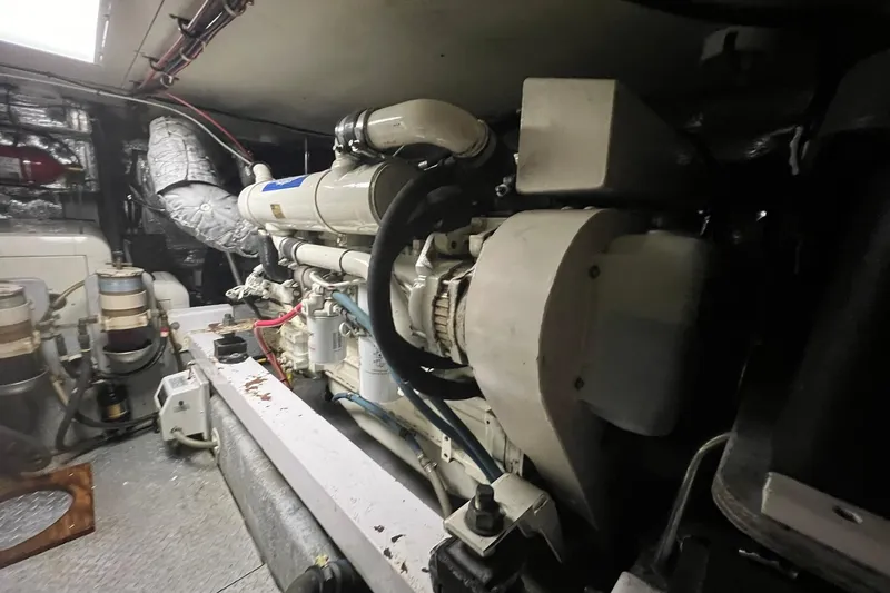 Slide: The Image of Engine room of a 2000 Silverton 453 Motor Yacht, showcasing mechanical components. - 46