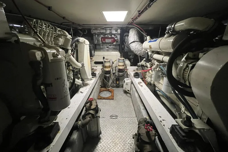 Slide: The Image of Engine room of a 2000 Silverton 453 Motor Yacht, showcasing mechanical components. - 47