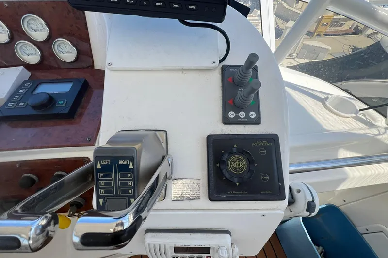 Slide: The Image of Control panel of a 2000 Silverton 453 Motor Yacht with navigation instruments. - 8