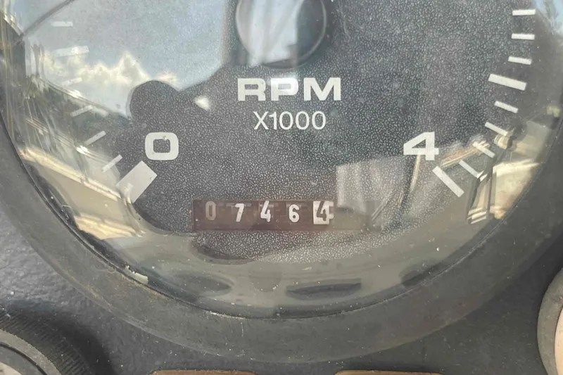 Slide: The Image of Close-up of a Hunter 410 tachometer showing 7464 RPM reading. - 18