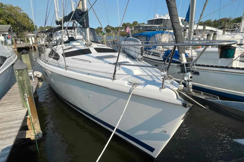 Slide: The Image of Sailboat docked at marina, Hunter 410 model, year 2000, in sunny weather. - 2