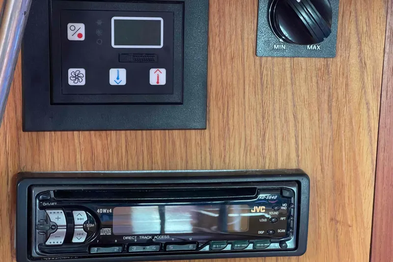Slide: The Image of Control panel and JVC stereo on Hunter 410, 2000 model, wooden interior. - 22