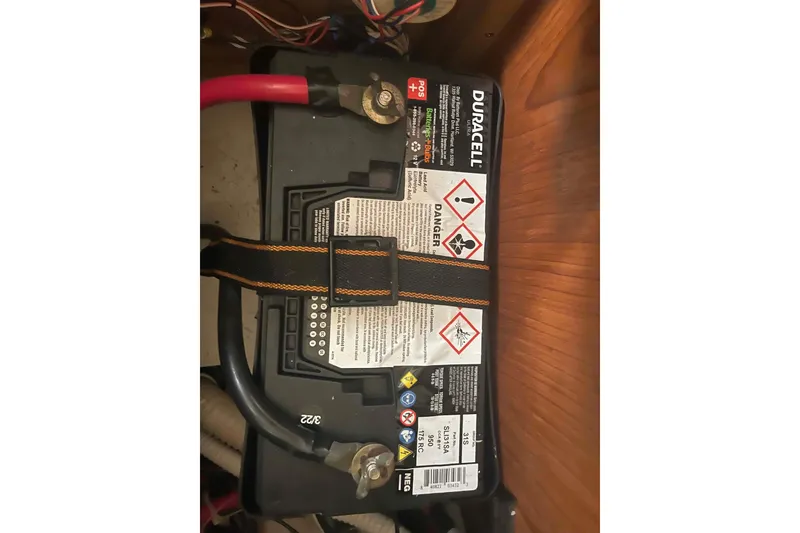 Slide: The Image of Duracell battery in a 2000 Hunter 410 boat, secured with a strap. - 24