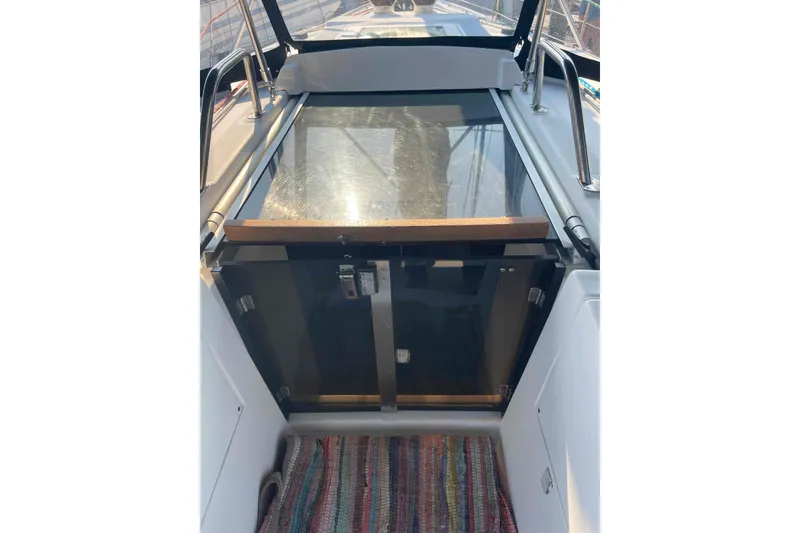 Slide: The Image of Cockpit view of a 2000 Hunter 410 sailboat with a colorful rug. - 4