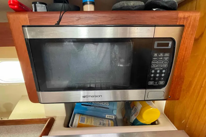 Slide: The Image of Emerson microwave in a 2000 Hunter 410 boat kitchen, with storage below. - 40