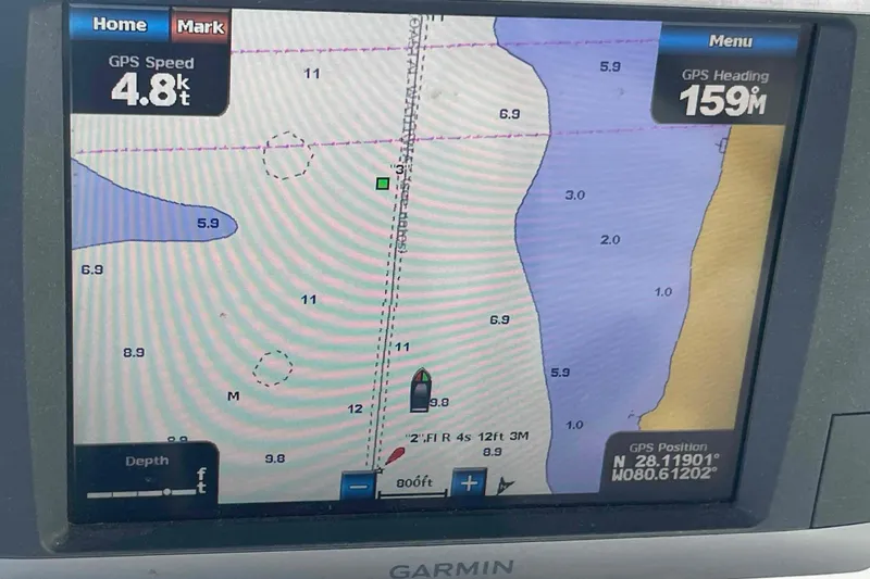 Slide: The Image of Garmin GPS display showing nautical chart, speed 4.8 knots, heading 159 degrees, Hunter 410, year 2000. - 56