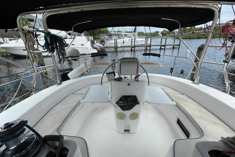 Slide: The Image of Cockpit view of a 2000 Hunter 410 sailboat docked at a marina. - 58