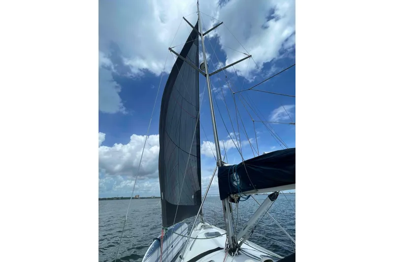 Slide: The Image of Sailing on a 2000 Hunter 410 yacht under a clear blue sky. - 60