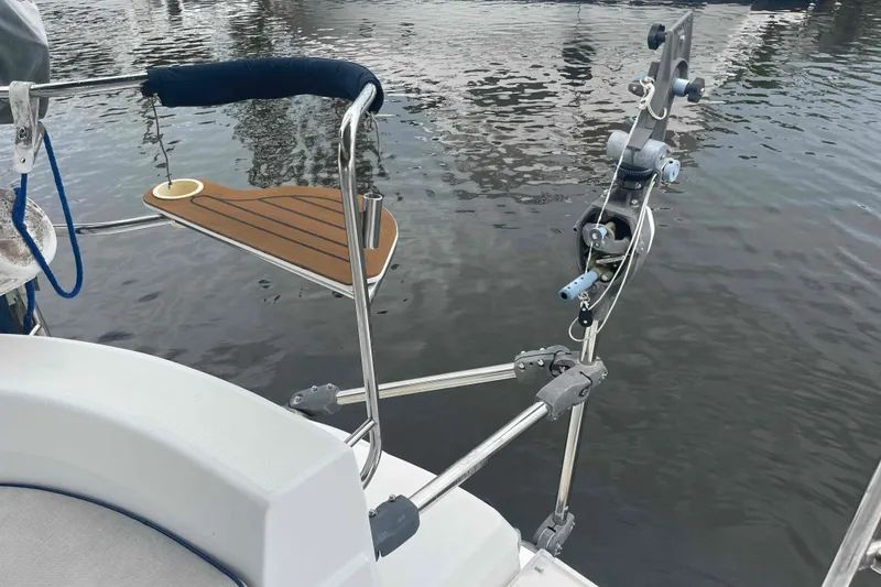 Slide: The Image of Rear deck of a 2000 Hunter 410 sailboat with water backdrop. - 69