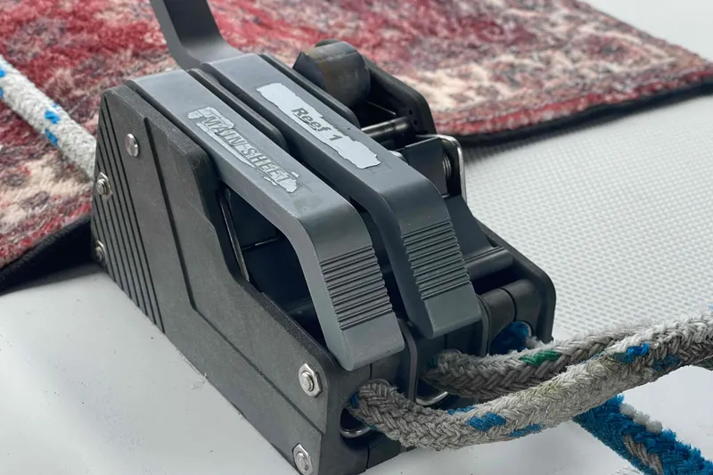 Slide: The Image of Close-up of a Hunter 410 sailboat rope clutch mechanism, year 2000, with colorful ropes. - 74