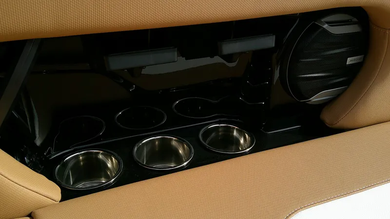 Slide: The Image of Interior of 2026 MasterCraft NXT24 with speaker and cup holders. - 11