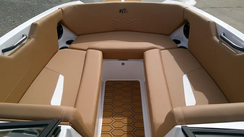 Slide: The Image of Interior of 2026 MasterCraft NXT24 boat with beige upholstery. - 16