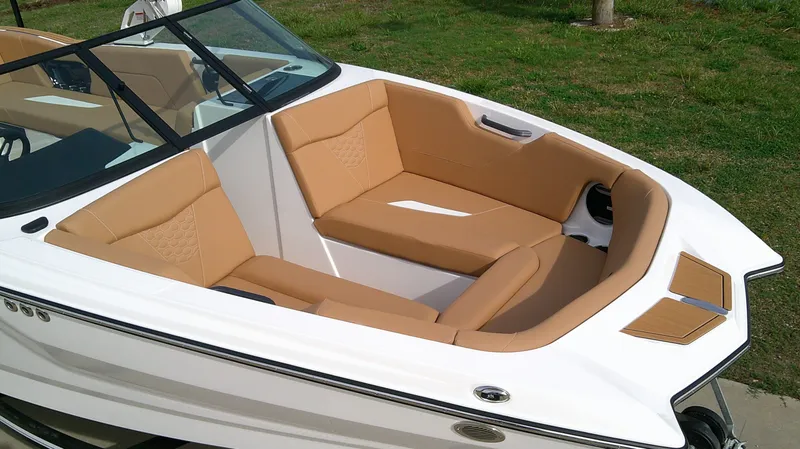 Slide: The Image of 2026 MasterCraft NXT24 boat with luxurious beige seating. - 4