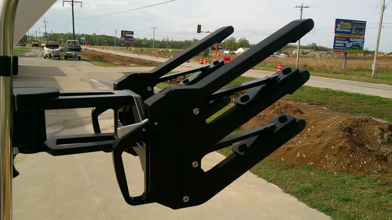 Slide: The Image of MasterCraft NXT24 2026 with wakeboard rack on parking lot. - 9