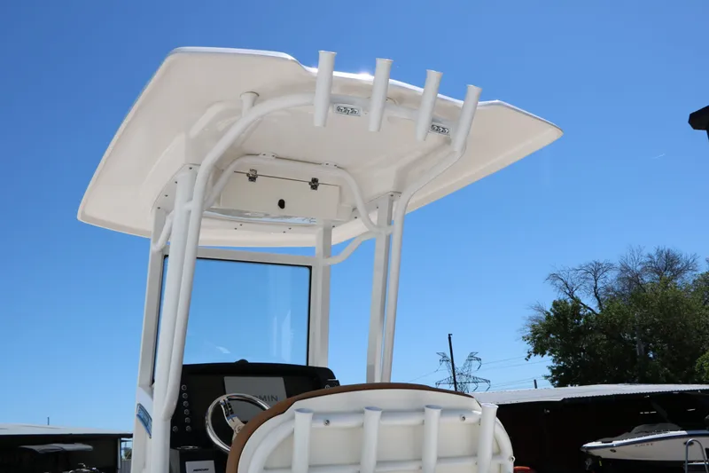 Slide: The Image of Robalo 246 Cayman 2026 boat with T-top and helm console. - 11
