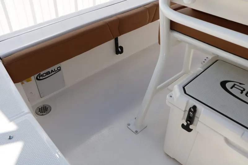 Slide: The Image of Interior of 2026 Robalo 246 Cayman with seating and storage. - 39