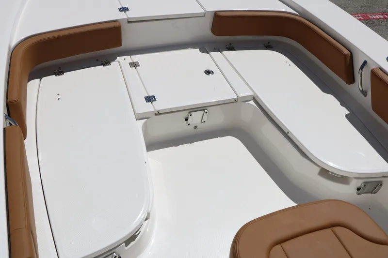Slide: The Image of Interior of 2026 Robalo 246 Cayman with brown upholstery. - 43
