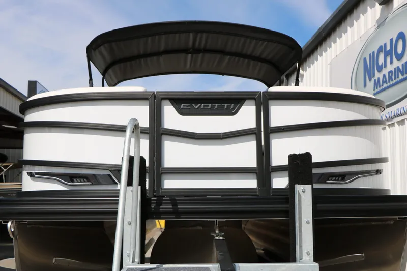 Slide: The Image of Evotti 725 CS Tri Toon 2026 pontoon boat at a marina. - 7