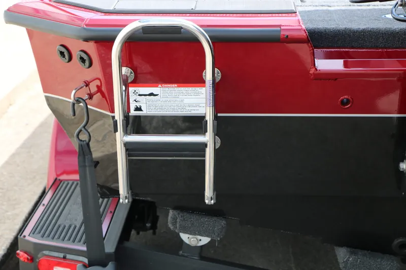 Slide: The Image of Red Vexus AVX 1985s boat rear with ladder, year 2026. - 11