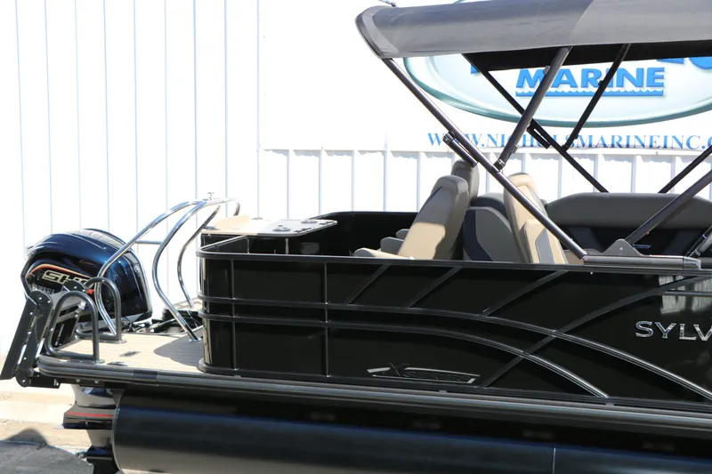 Slide: The Image of Sylvan Mirage X3 Party Fish Tri Toon 2026 with motor and seating area. - 11