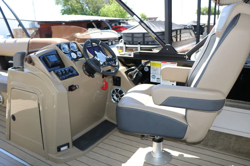 Slide: The Image of Interior of 2026 Sylvan Mirage X3 Party Fish Tri Toon with helm console. - 29