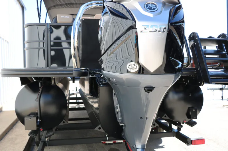 Slide: The Image of 2026 Sylvan Mirage X3 Party Fish Tri Toon with powerful outboard motor. - 44