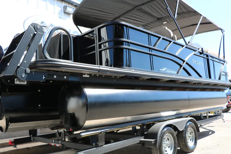 Slide: The Image of 2026 Sylvan Mirage X3 Party Fish Tri Toon on trailer. - 6