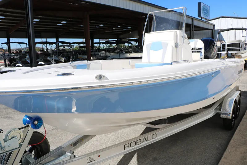 Slide: The Image of 2026 Robalo 226 Cayman boat on trailer outdoors. - 14